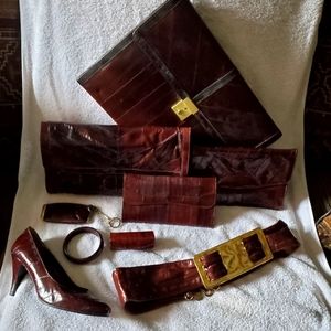 Oxblood Eel Skin  notebook, 2 purses, wallet, belt, braclett, lipstick, coin...